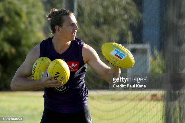 Nathan Fyfe acknowledges a small group of supporters during a Fremantle Dockers AFL training session at Victor George Kailis Oval on May 18, 2020 in...