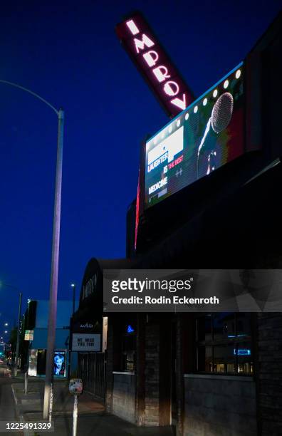 The Hollywood Improv Comedy Club marquee reads, "We miss you too" during the coronavirus pandemic on May 17, 2020 in West Hollywood, California....