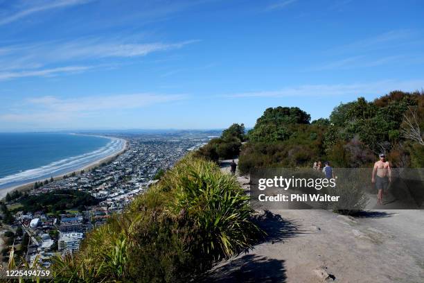 People walk up Mount Maunganui after it was reopened to people following the move to Level 2 on May 18, 2020 in Tauranga, New Zealand. New Zealand...