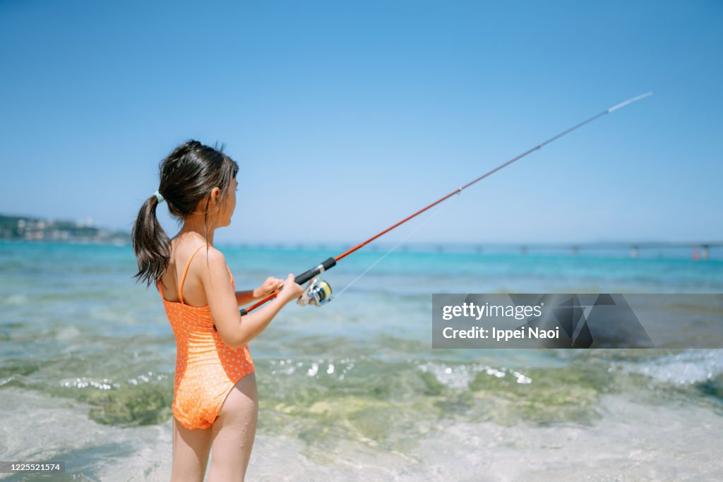 Young Girl Fishing From Beach Okinawa Japan High-Res Stock Photo - Getty  Images