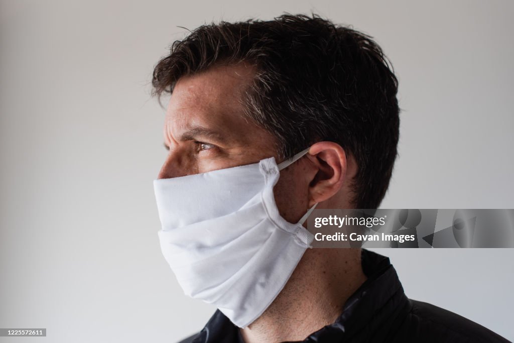 Man wearing homemade cloth face mask during Covid 19 pandemic.