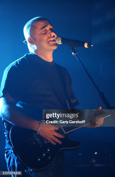 American Rock & Nu Metal musician Aaron Lewis, of the group Staind, plays guitar as he performs onstage at the Hammerstein Ballroom, New York, New...