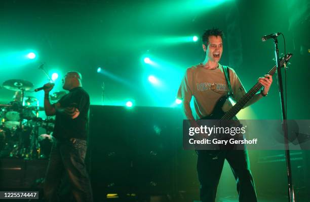 American Rock & Nu Metal musicians Aaron Lewis, on vocals, and Johnny April, on bass guitar, both of the group Staind, perform onstage at the...