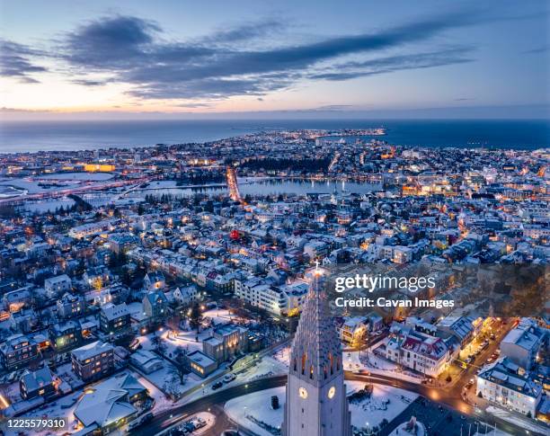 majestic drone view of reykjavik city center in twilight - hallgrimskirkja bildbanksfoton och bilder