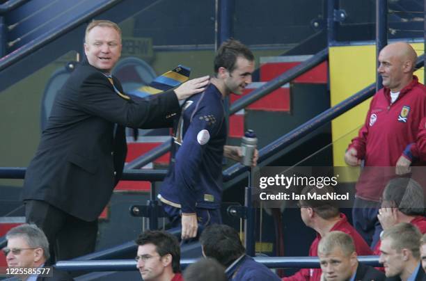 James McFadden of Scotland is seen with manager Alex McLeish as he leaves the field during the Euro 2008 Group B qualifying match between Scotland...