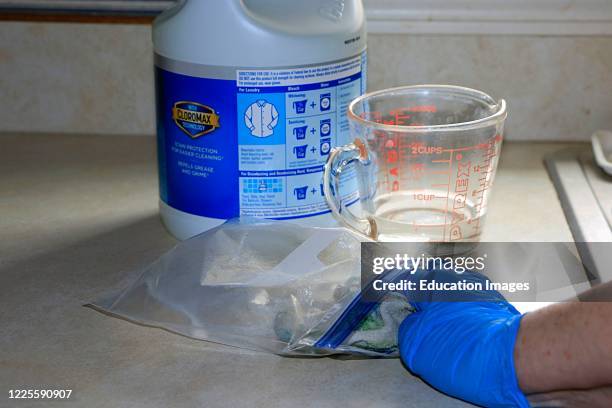 Do it yourself sanitizing rag made made using 1 part chlorine bleach and 5 parts water and applied to rag, for use in disinfecting surfaces when...