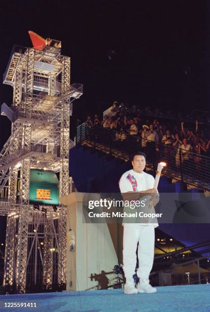 Olympic gold medallist and Heavyweight Boxing World Champion Muhammad Ali of the United States carries the Olympic Flame during the Opening Ceremony...