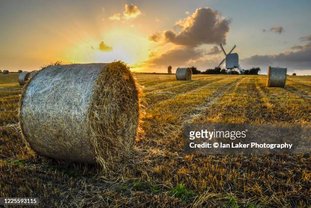 chillenden, kent, england, uk. 3 september 2006. chillenden mill and harvested corn field at sunset, kent, uk - september uk stock pictures, royalty-free photos & images