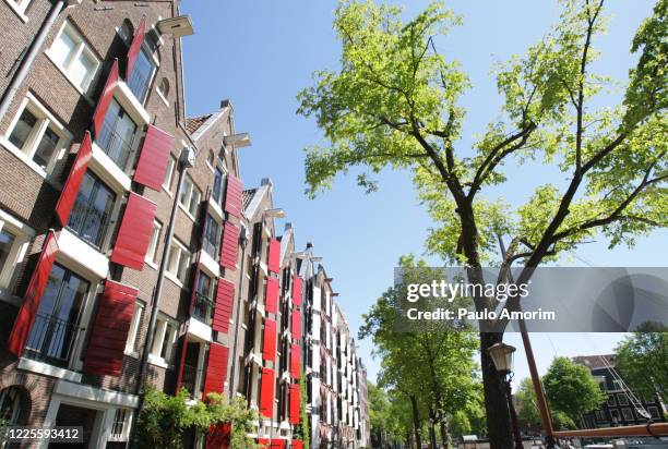 amsterdam city amid the coronavirus pandemic - canal house stock pictures, royalty-free photos & images