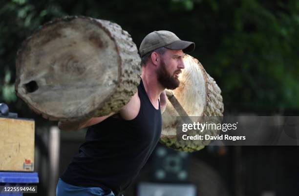 Tom Wood, the Northampton Saints and England back row forward, works out in his garden on May 18, 2020 in Northampton, United Kingdom.