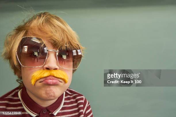 young child styled as a retro 1970s adult - moustaches stock pictures, royalty-free photos & images