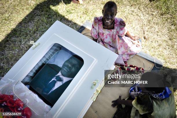 Woman mourns at the funeral of murdured activist David Kato near Mataba, on January 28, 2011. Although the police claims it was most likely a petty...