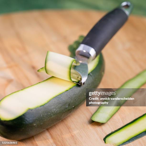 zuchinni slices - peeler stock pictures, royalty-free photos & images