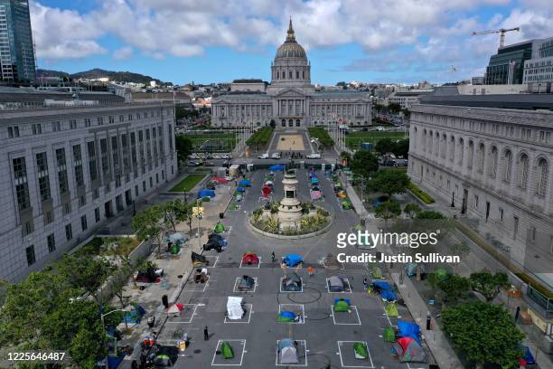 An aerial view of San Francisco's first temporary sanctioned tent encampment for the homeless on May 18, 2020 in San Francisco, California. After...