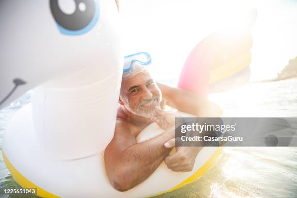 Guy On Inflatable Raft Mask Raft Photos and Premium High Res Pictures - Getty Images
