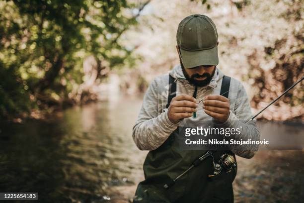fisherman close up - waders imagens e fotografias de stock