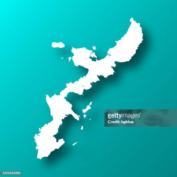 okinawa island map on blue green background with shadow - okinawa prefecture stock illustrations