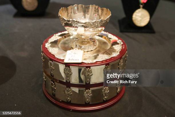John McEnroe 1984 Davis Cup runner-up trophy is displayed at a press preview for sports legends featuring Kobe Bryant, FIFA and Olympic Medals at...