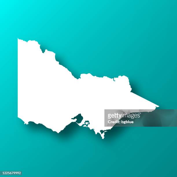 victoria-karte auf blau-grünem hintergrund mit schatten - victoria australia stock-grafiken, -clipart, -cartoons und -symbole