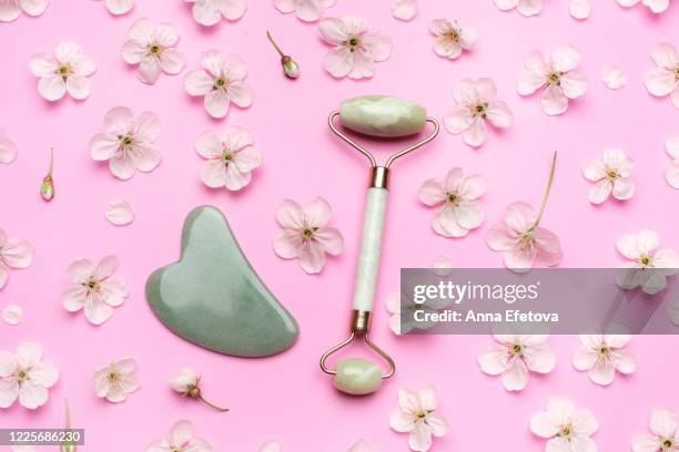 face roller and gua sha - jade stock pictures, royalty-free photos & images