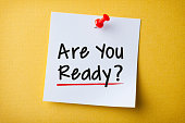 White Sticky Note With Are You Ready And Red Push Pin On Yellow Background