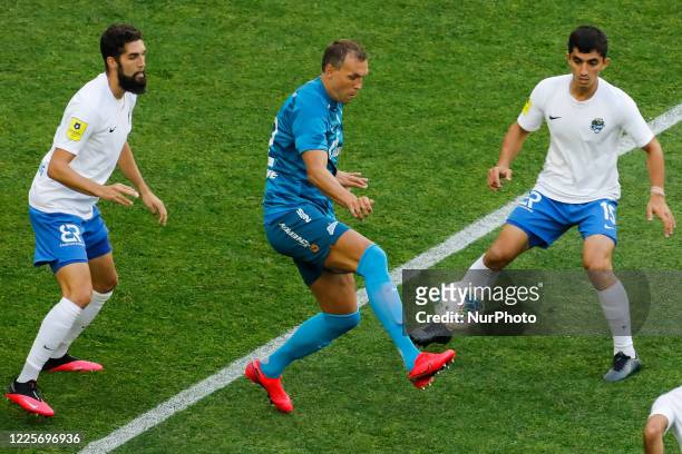 Artem Dzyuba of Zenit Saint Petersburg in action against Miha Mevlja and Ibragim Tsallagov of PFC Sochi during the Russian Premier League match...