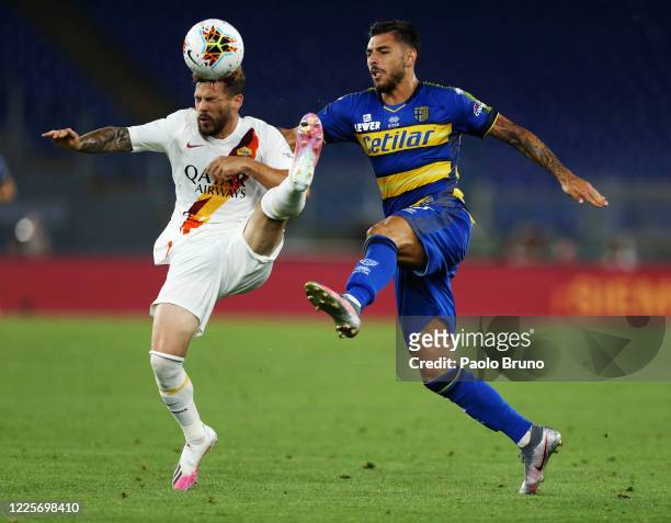 Carles Perez of AS Roma competes for the ball with Giuseppe Pezzella of Parma Calcio during the Serie A match between AS Roma and Parma Calcio at...