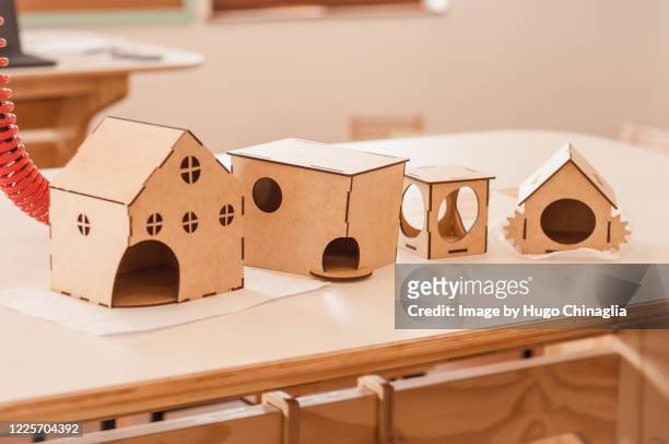 maker space, building birdhouses at school - sweet little models stock pictures, royalty-free photos & images