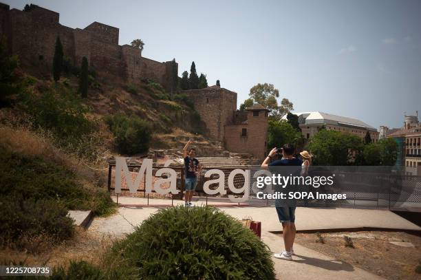 Tourist is seen posing for a photo at Alcazaba viewpoint. Spaniards continue living daily life under the new normality following the Covid-19 crisis....