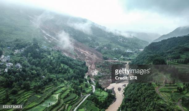 This aerial photo taken on July 8, 2020 shows the scene of a landslide in Songtao Miao autonomous county, Tongren city, in China's southwestern...