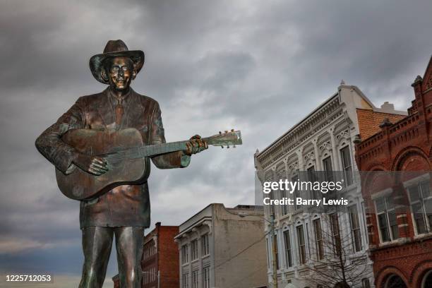 Life-size statue of the famed country music legend, Hank Williams stands where his career started, in the center of the Riverfront Entertainment...