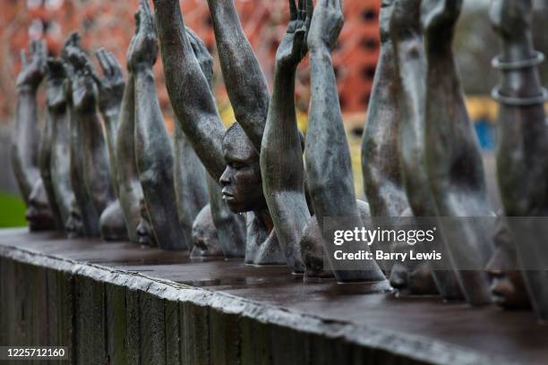 Hank Willis Thomas' 'Raise Up' statue, which depicts contemporary issues of police violence and racially biased criminal justice in the National...