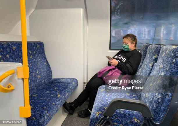 Passenger travels on a train from Bondi Junction Station on May 19, 2020 in Sydney, Australia. Strict social distancing measures have been introduced...