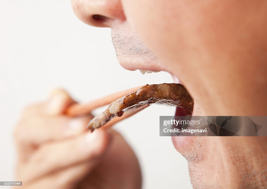 A man eating korean barbecue