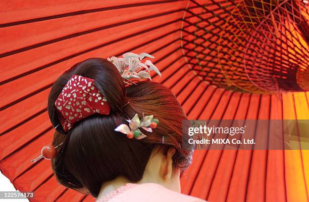 rear view of a geisha woman, close-up - geisha stock-fotos und bilder