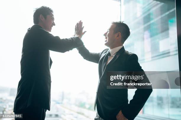 businessman meet-up handshake - talking friends backlight stock pictures, royalty-free photos & images