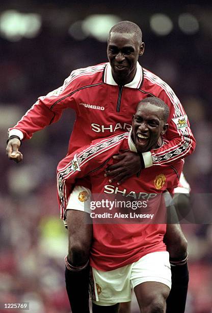 Andy Cole of Manchester United celebrates a goal with team mate Dwight Yorke during the FA Carling Premiership match against Newcastle United at Old...