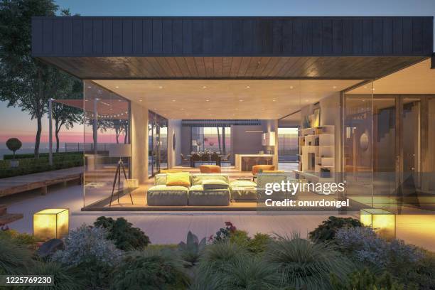 modern house outdoors at night - glass entrance imagens e fotografias de stock