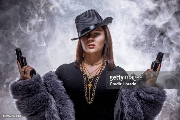 sexy female caucasian gangster woman - female gangster stock pictures, royalty-free photos & images