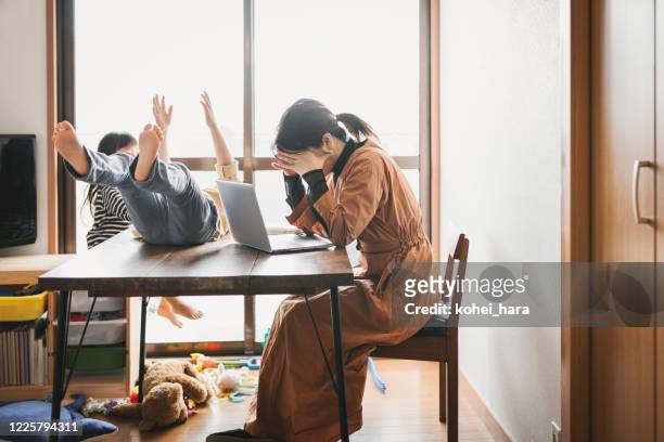 mother working from home with children - emotional stress stock pictures, royalty-free photos & images