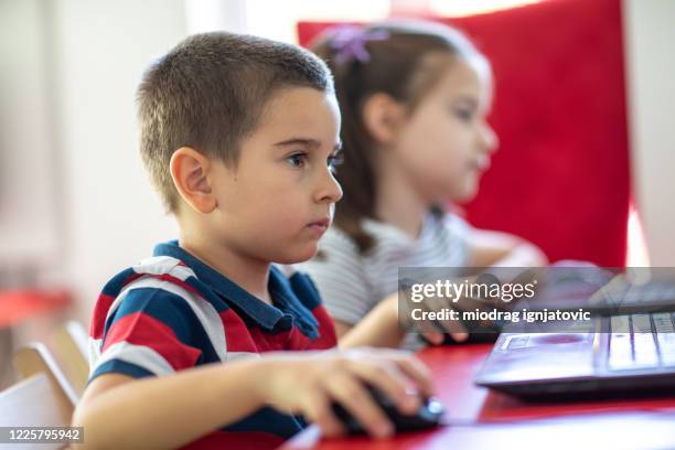 education is the key to a better future - student sitting in desk side view stock pictures, royalty-free photos & images