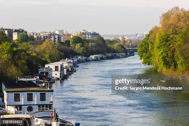 a view down the seine river in paris france - hauts de seine stock pictures, royalty-free photos & images