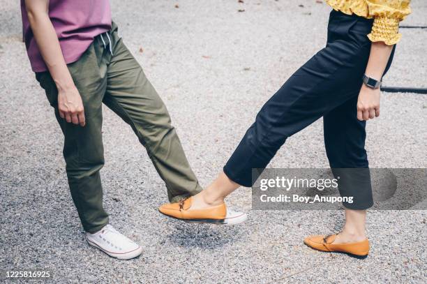 cropped shot of two woman foot tap for greeting during coronavirus epidemic. - die neue normalität stock-fotos und bilder