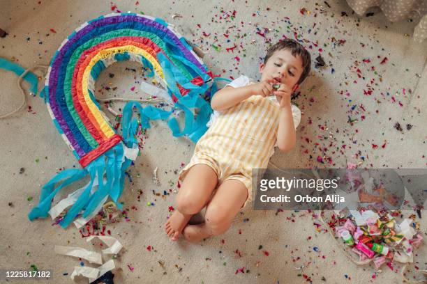 birthday party during coronavirus lockdown - rainbow confetti stock pictures, royalty-free photos & images