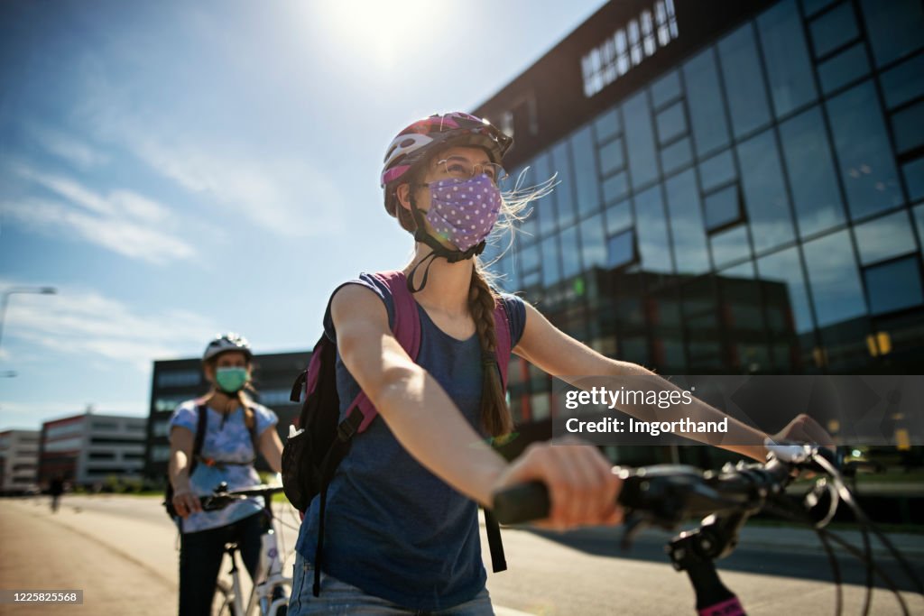 Mother and daughter riding bikes during Covid-19 pandemic