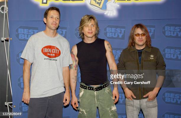 Portrait of, from left, American Pop Rock musicians Mike Malinin, Johnny Rzeznik, and Robby Takac, all from the band Goo Goo Dolls, as they pose...