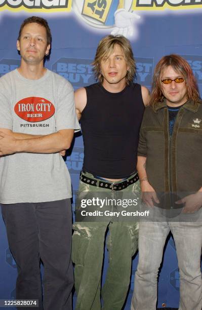 Portrait of, from left, American Pop Rock musicians Mike Malinin, Johnny Rzeznik, and Robby Takac, all from the band Goo Goo Dolls, as they pose...