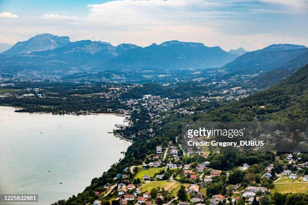 elevated viewpoint over small french village of bourdeau on the edge of lake bourget near aix les bains and chambery city in alps mountains - chambéry stock pictures, royalty-free photos & images