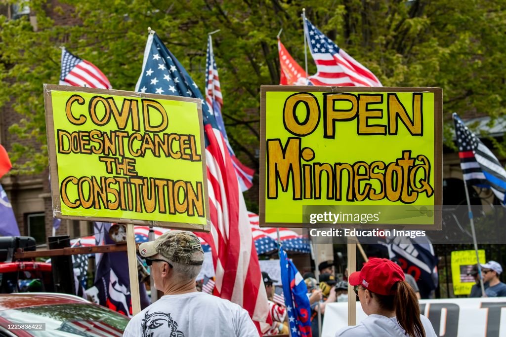 Protest at Governor Tim Walz's mansion to reopen Minnesota, Covid Doesn't Cancel Constitution sign.