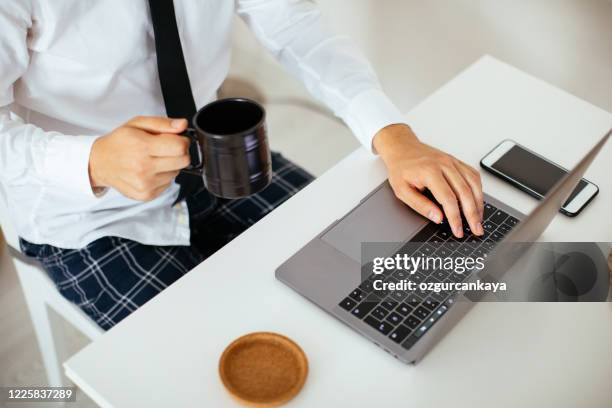 having a productive day - suit pajamas stock pictures, royalty-free photos & images